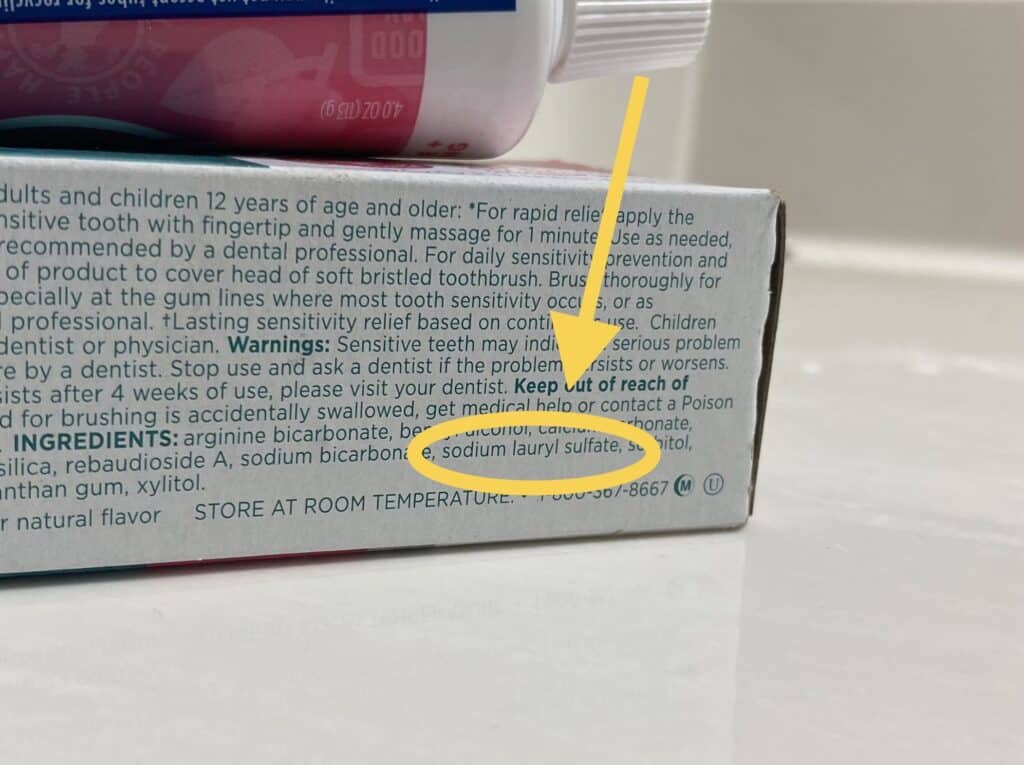 sodium lauryl sulfate listed on a toothpaste bottle