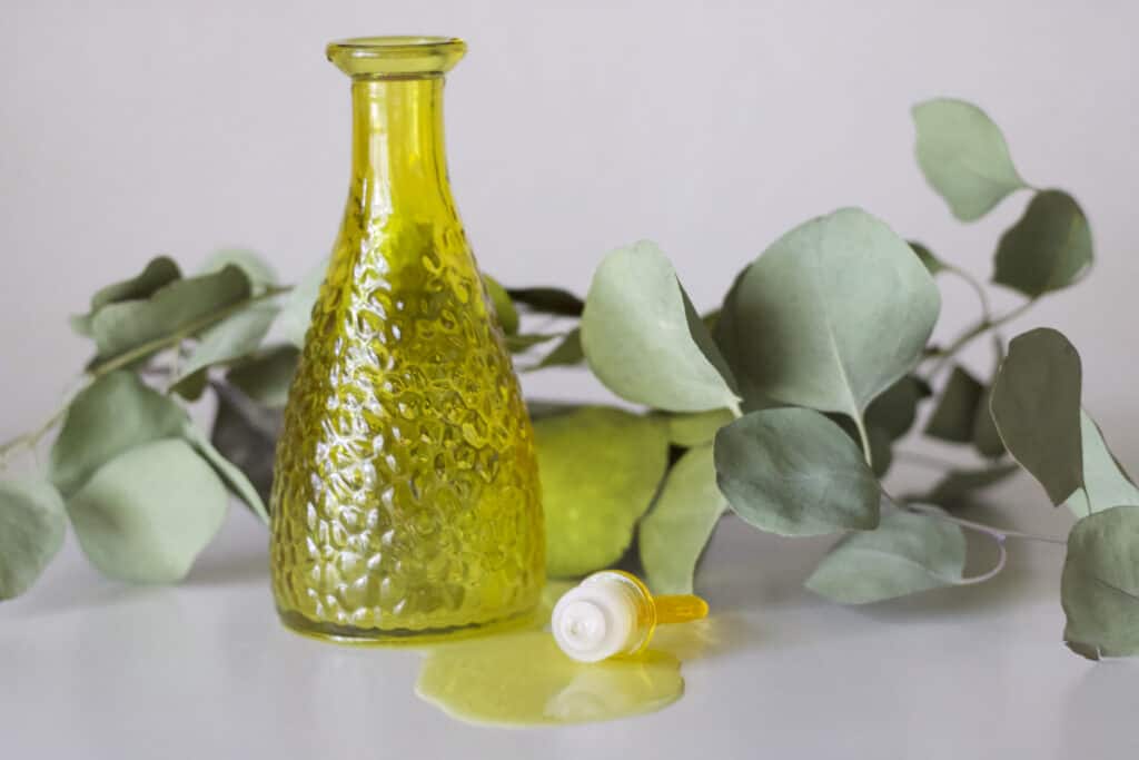 a glass bottle filled with olive oil