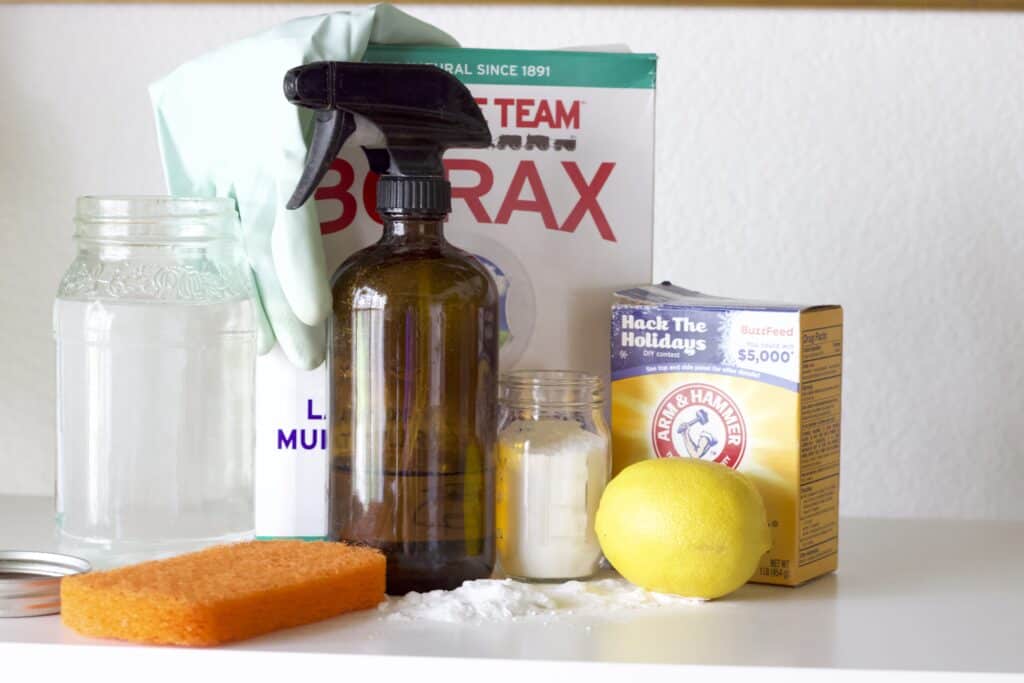eco friendly cleaning supplies including lemon, baking soda, alcohol, and borax