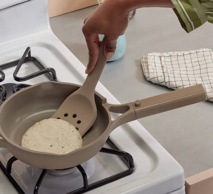 flipping a pancake in a pan