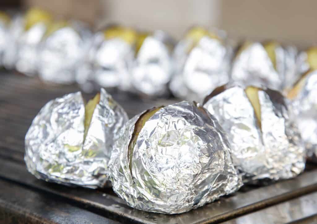 baked potatoes wrapped in aluminum