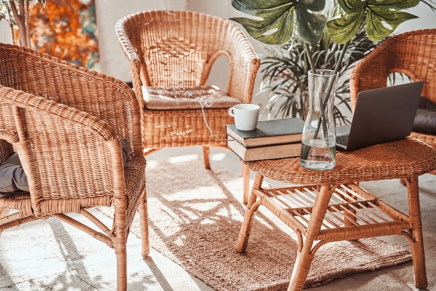 bamboo chairs next to a bamboo table