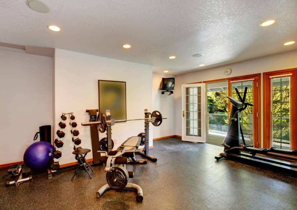 a workout room with various fitness equipment
