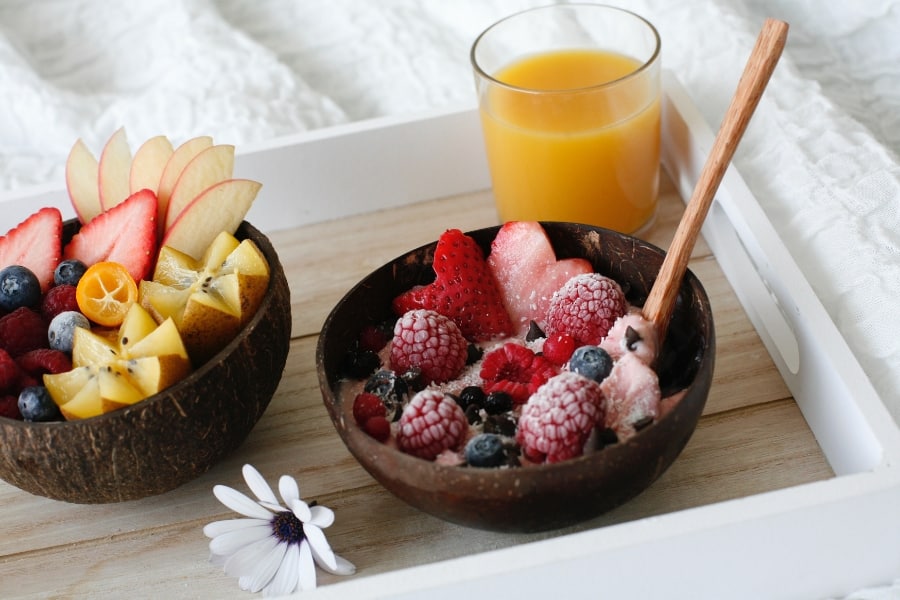 a coconut bowl with fruit inside