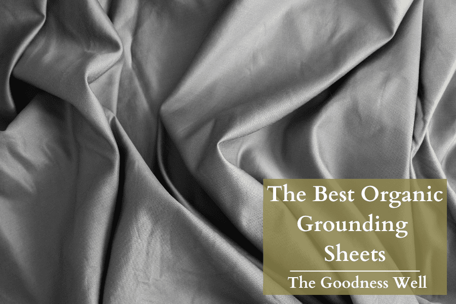 a grey grounding sheet on a bed