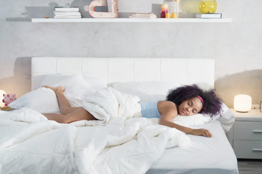 a woman sleeping on a latex mattress