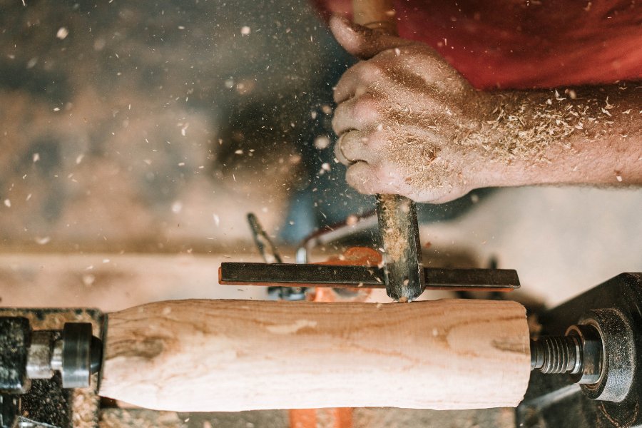 wood being shaved down into furniture