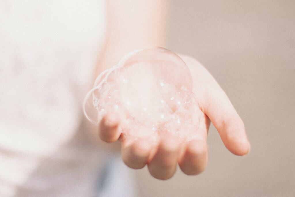 lathered bubbles in a persons hand