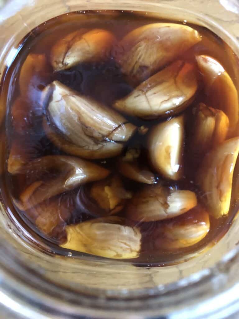 a jar with honey and garlic