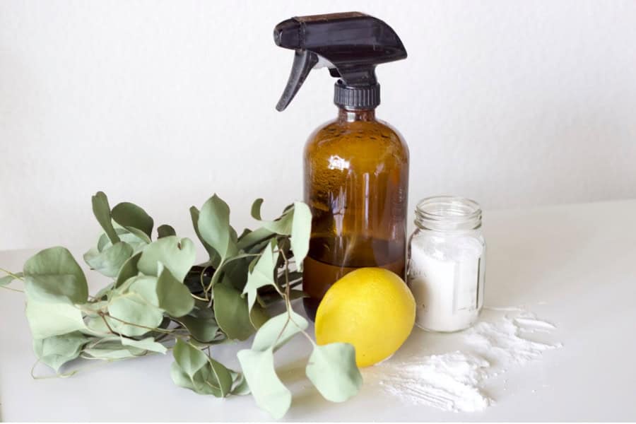 natural cleaning solution in glass spray bottle