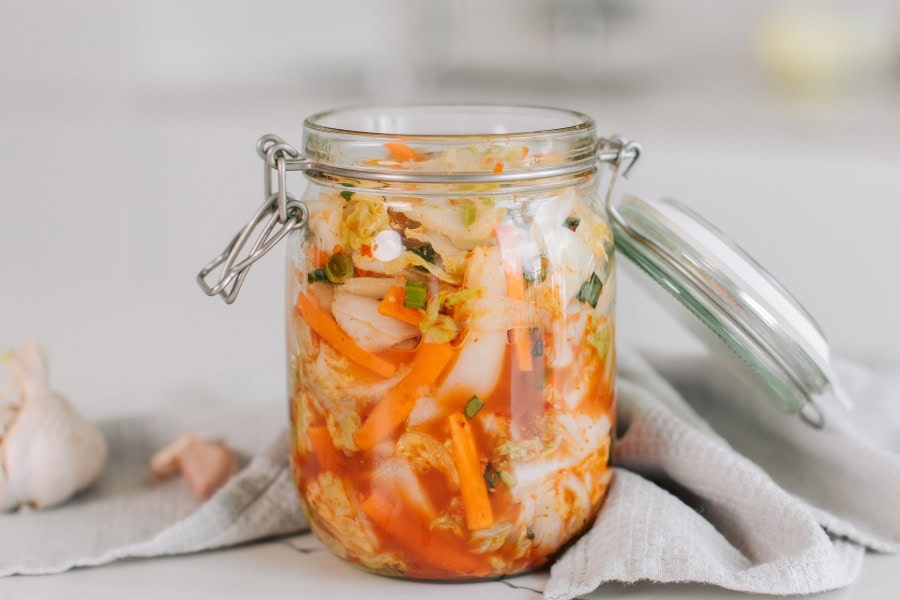 fermented kimchi in a glass jar 