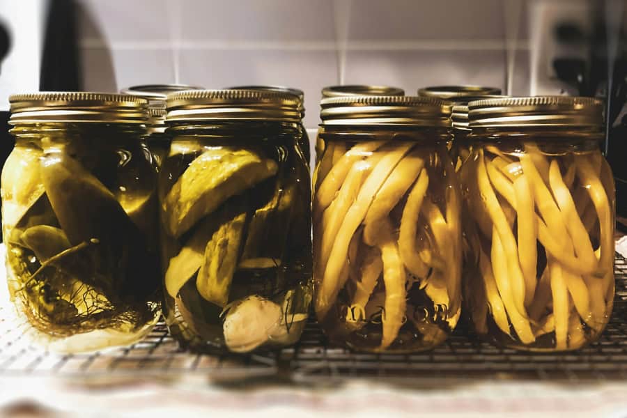 fermented pickles and peas in a jar