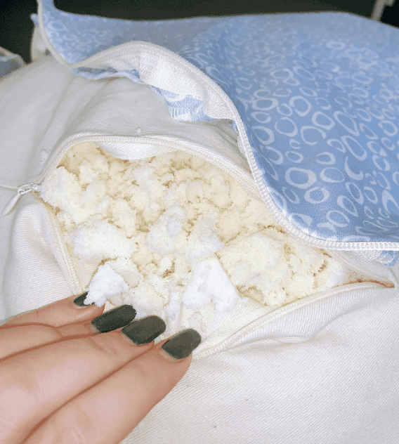 A bean bag unzipped showing its non toxic filling