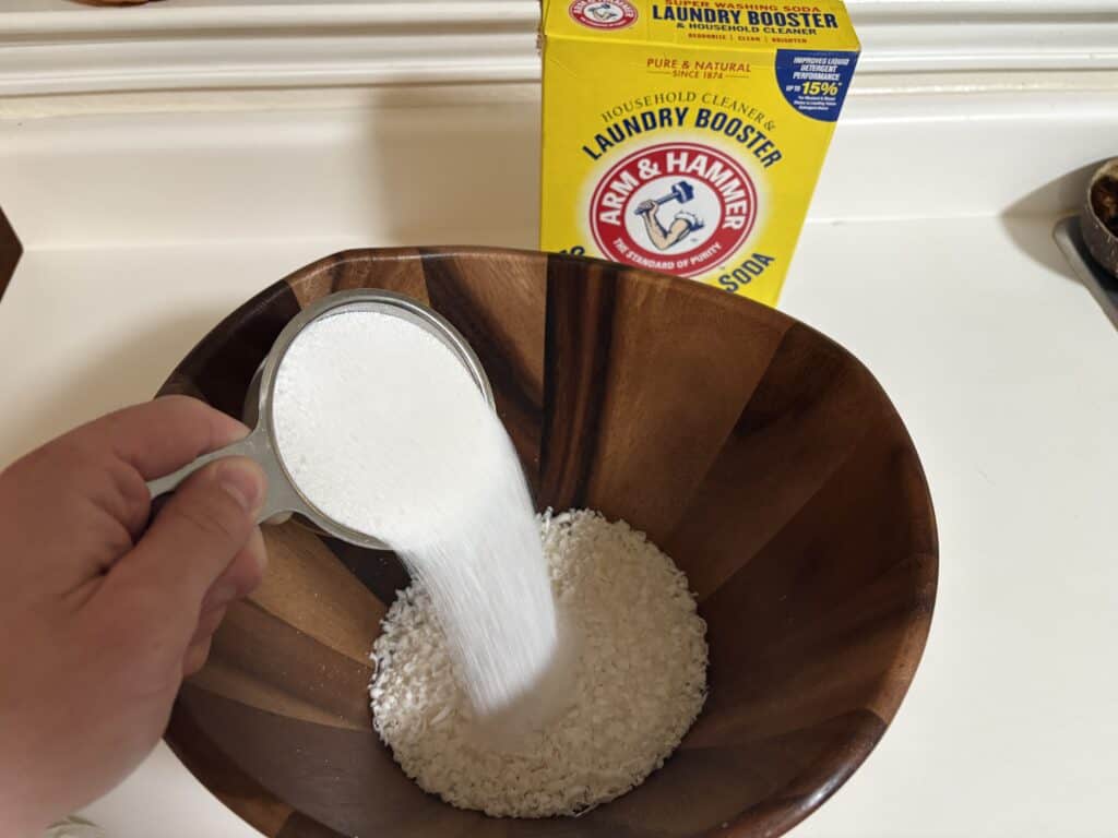 pouring washing soda into a bowl