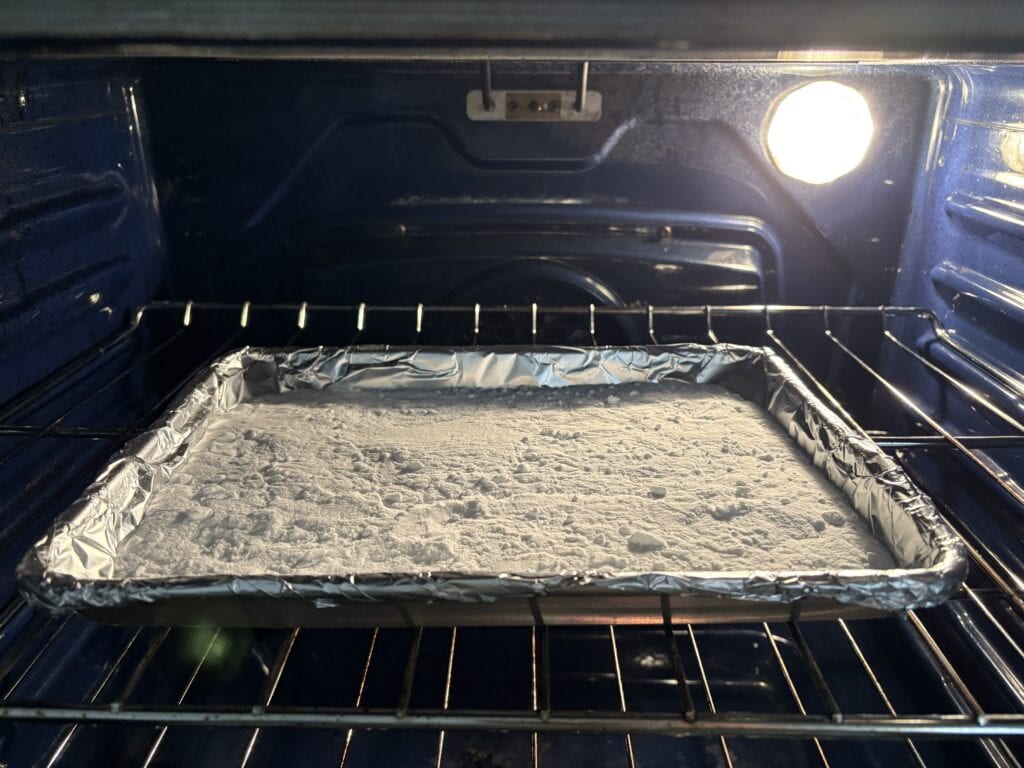 baking soda on a baking sheet in the oven