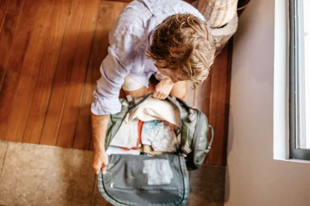 packing a gym bag with clothes