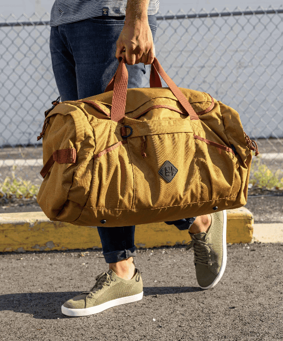 a man holding a gym bag