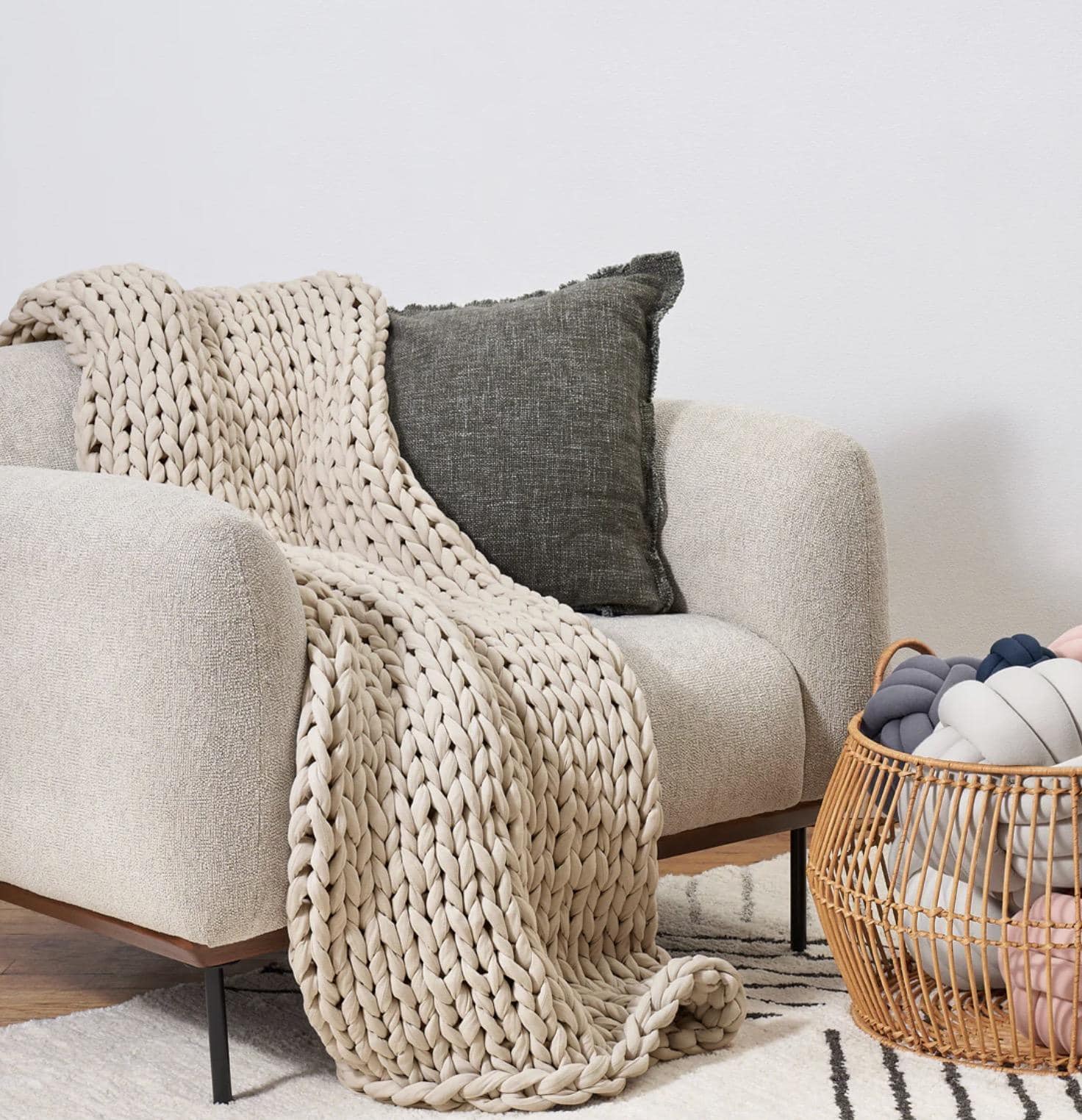 a blanket on a sofa chair