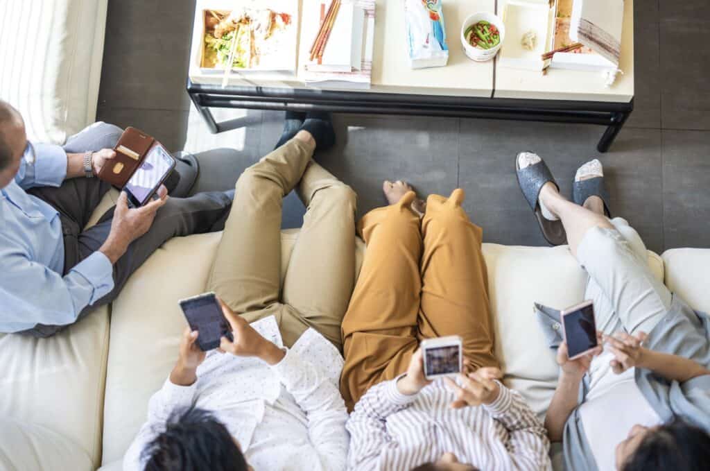 a room full of people glued to their phones