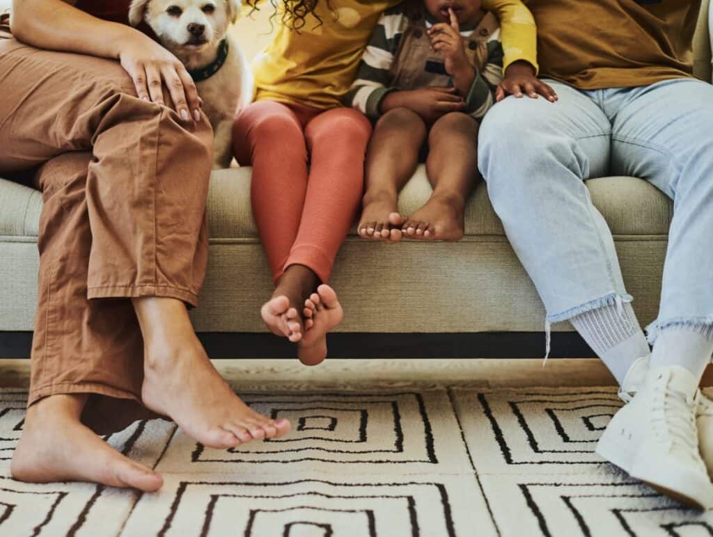 a family sitting on a couch