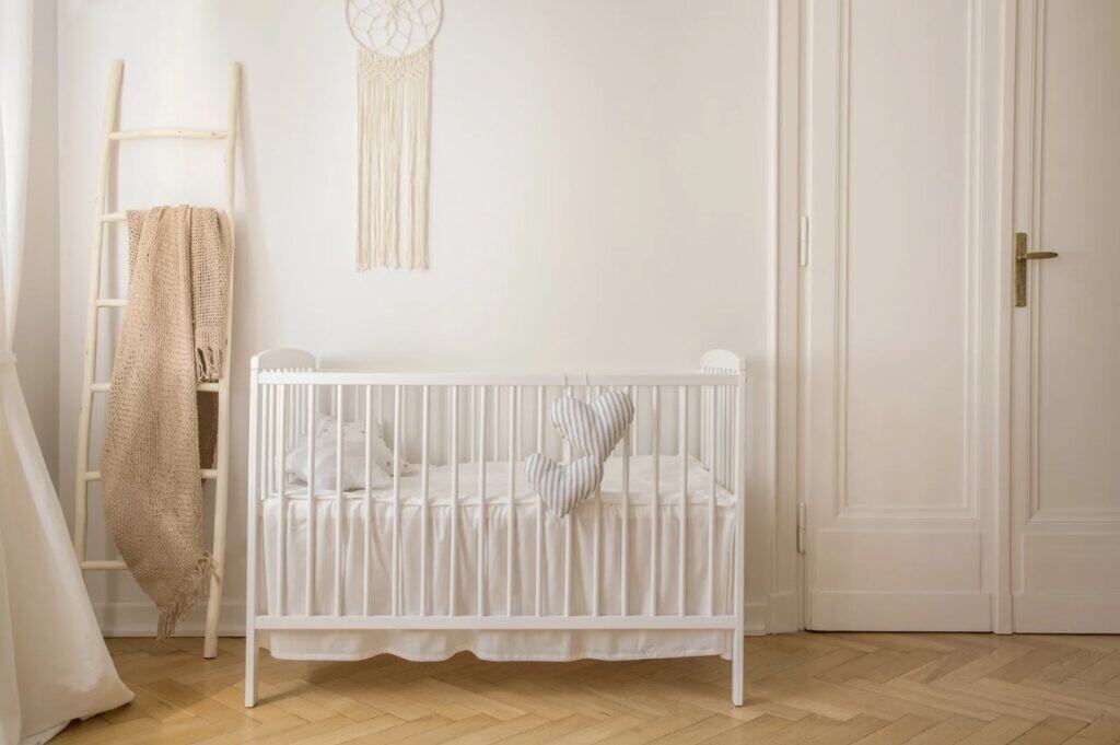 a wooden baby crib in a small room