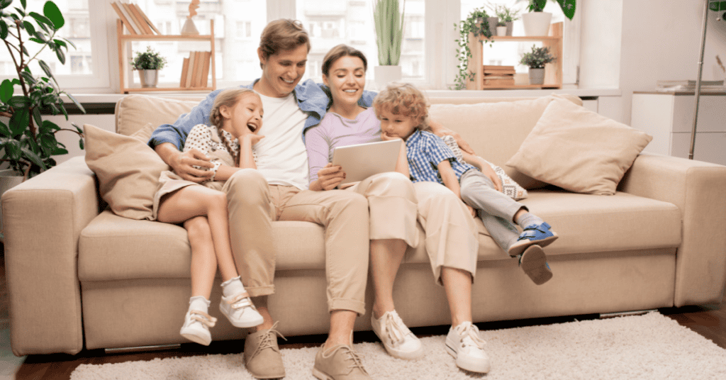 family sitting on couch living room