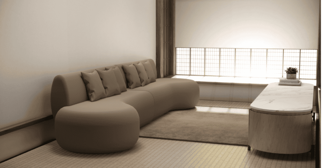 Modern curved couch in a minimalist room with natural light