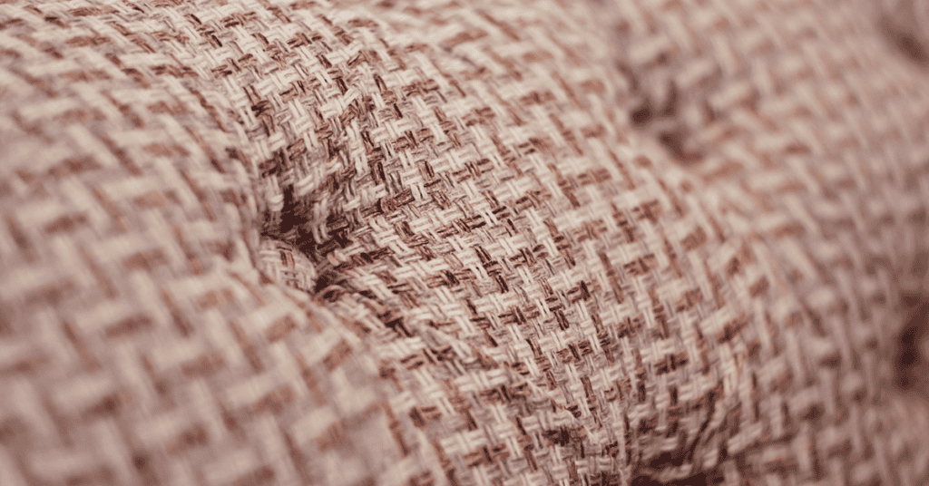 Close-up of woven upholstery fabric used on soft furniture.