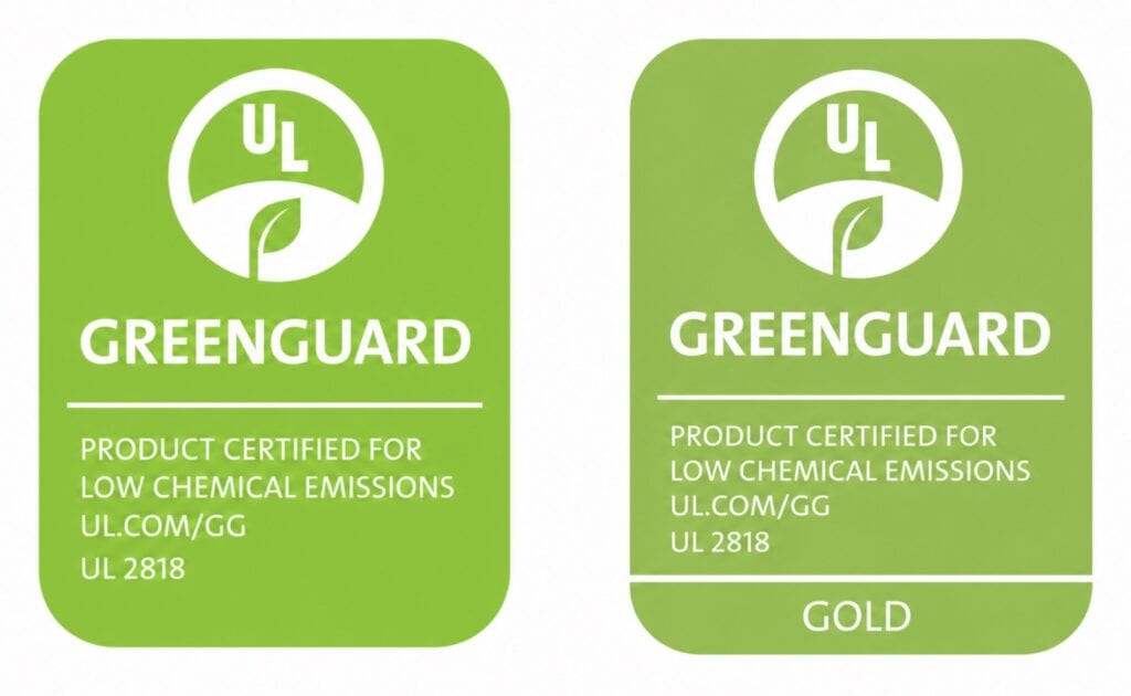 Side-by-side comparison of GREENGUARD Certified and GREENGUARD Gold certification labels on a white background, highlighting two third-party standards for low chemical emissions and improved indoor air quality.