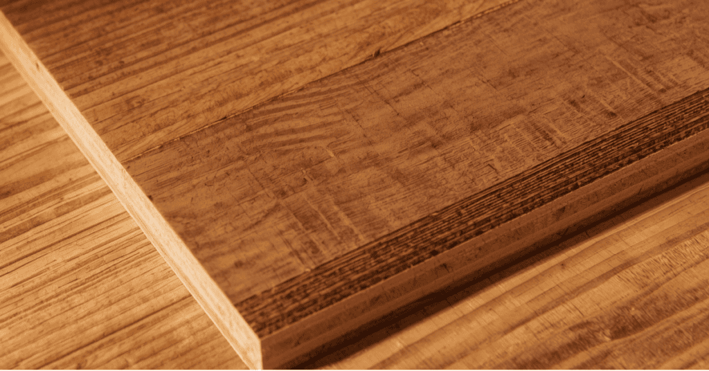 Close-up of wood veneer and particleboard edge showing the engineered wood core