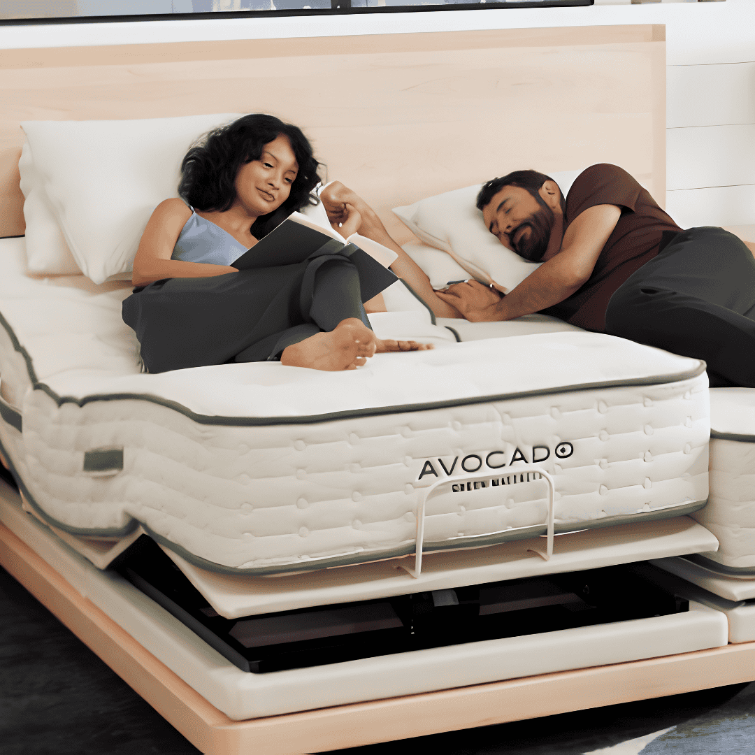 Couple relaxing on an Avocado mattress paired with an adjustable base.