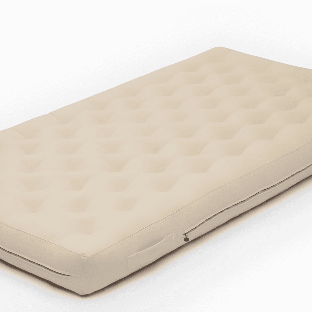 Cream tufted wool mattress with side handles on a white background.
