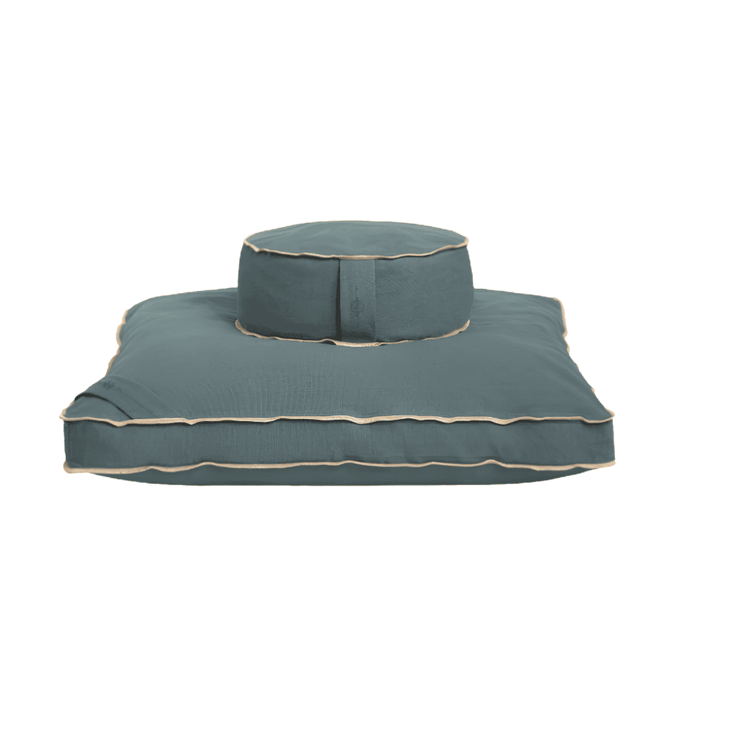 Teal round meditation cushion paired with a matching square floor mat.