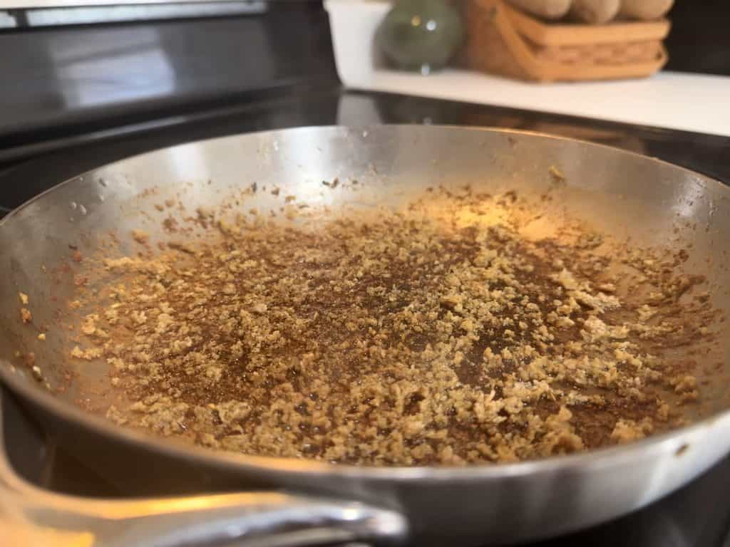 Stuck-on ground turkey residue in our Caraway stainless steel pan after cooking
