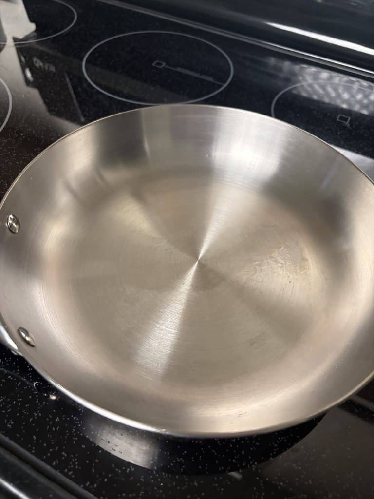 Close-up of the clean cooking surface inside our Caraway stainless steel frying pan